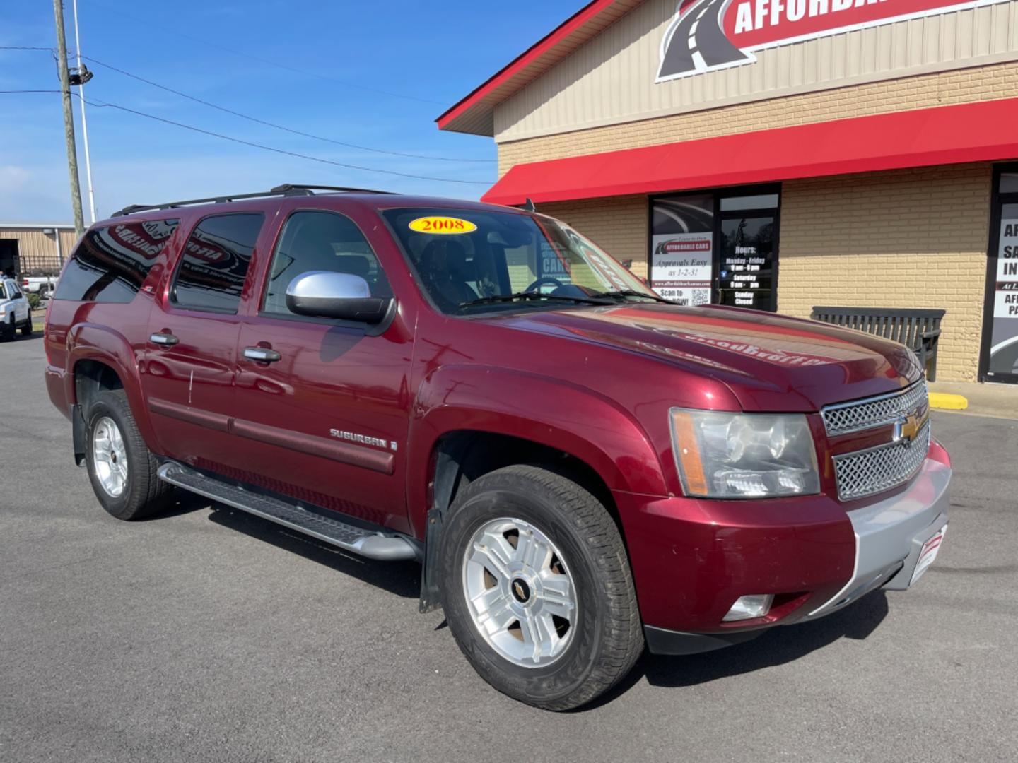 2008 Maroon Chevrolet Suburban 1500 (3GNFK16348G) with an V8, 5.3 Liter engine, Automatic, 4-Spd w/Overdrive transmission, located at 8008 Warden Rd, Sherwood, AR, 72120, (501) 801-6100, 34.830078, -92.186684 - Photo#1